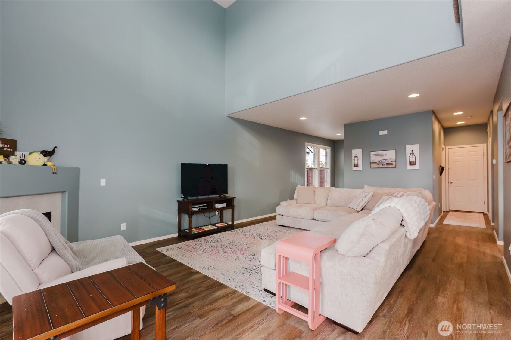 8324 Sweetbrier Loop Southeast Olympia, WA 98513 - Photo 5 of 39 a living room with furniture and a flat screen tv