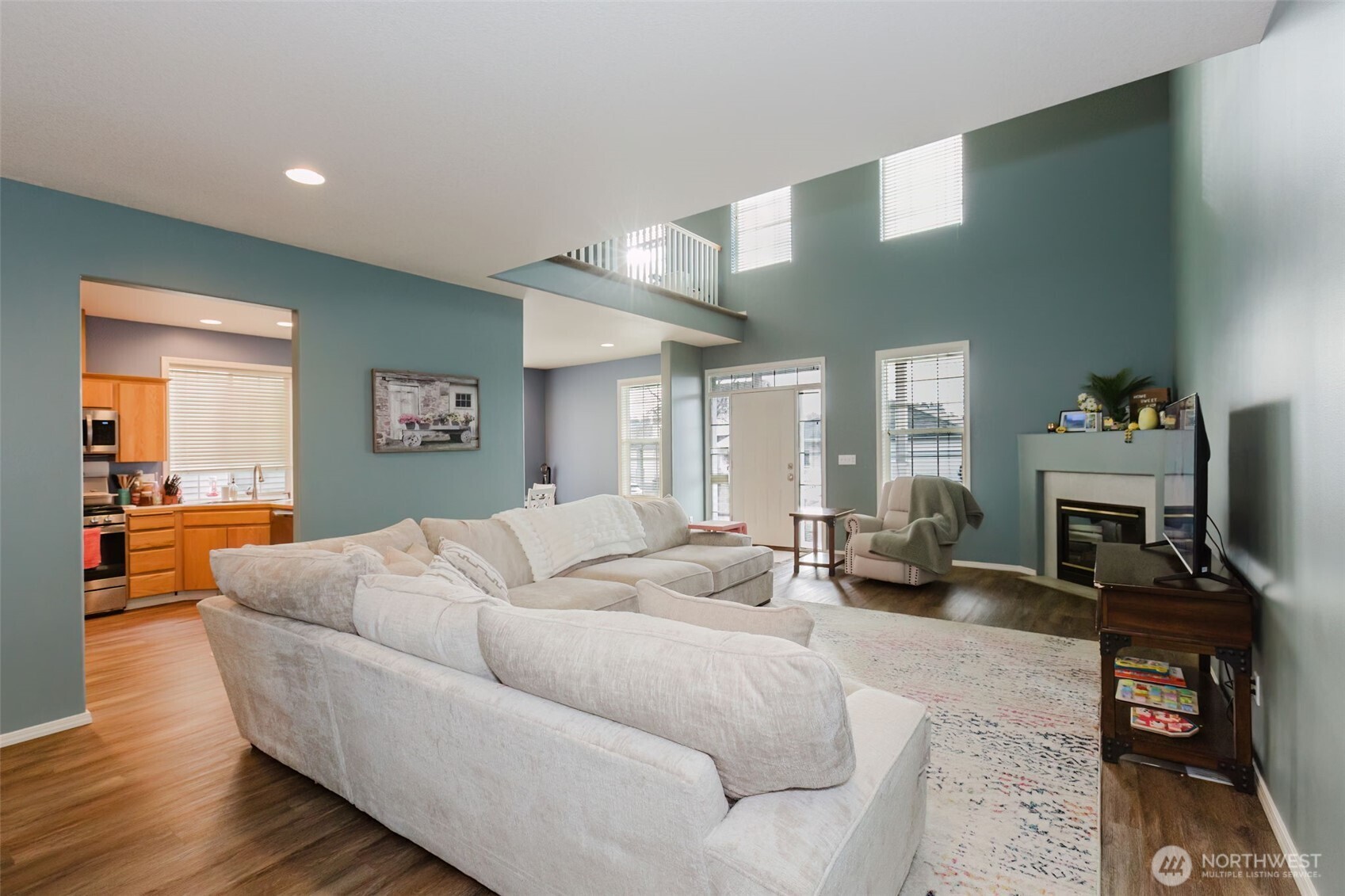 8324 Sweetbrier Loop Southeast Olympia, WA 98513 - Photo 6 of 39 a living room with furniture and a fireplace
