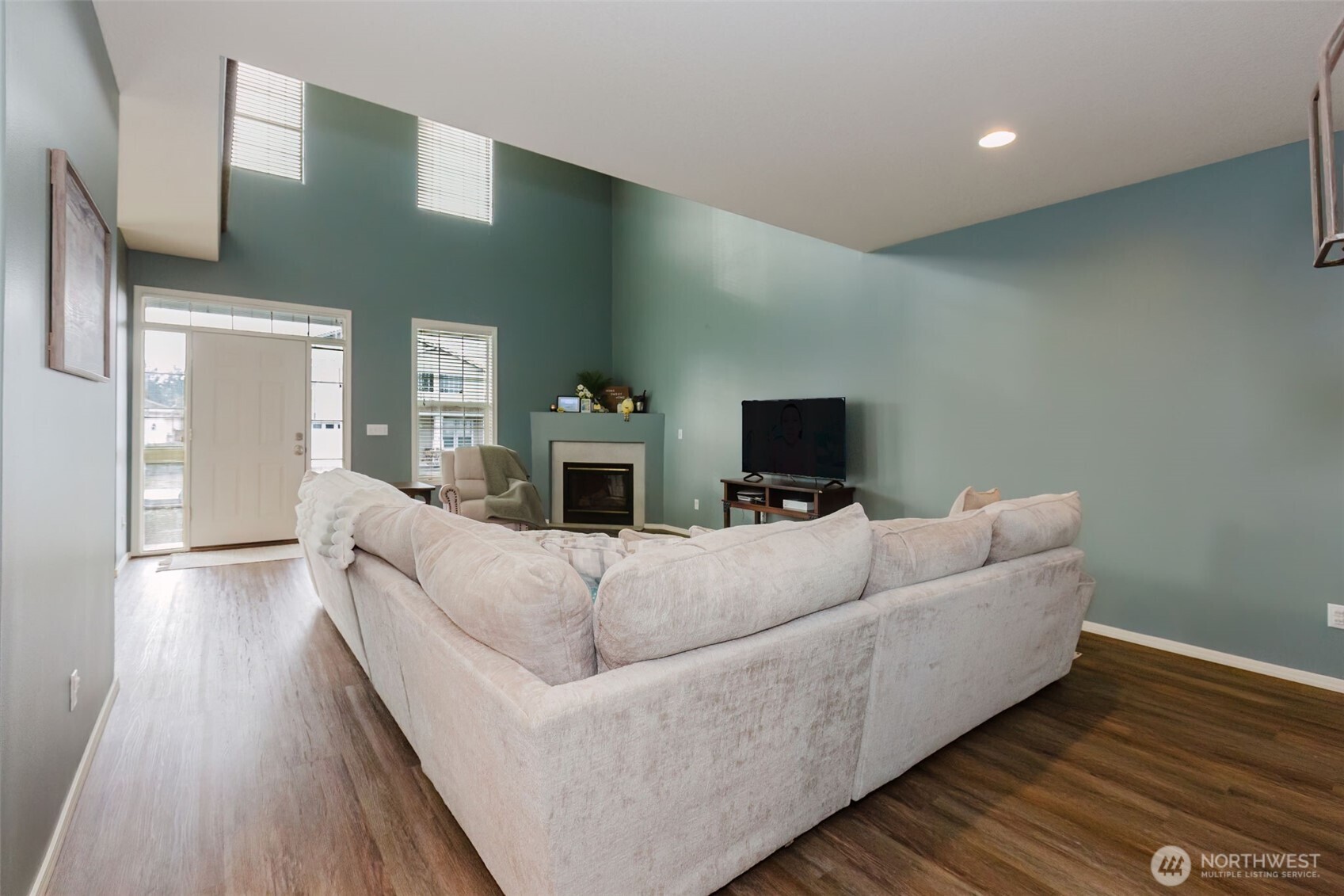 8324 Sweetbrier Loop Southeast Olympia, WA 98513 - Photo 7 of 39 a living room with furniture and a flat screen tv