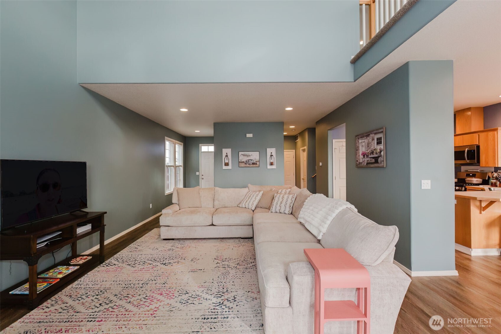8324 Sweetbrier Loop Southeast Olympia, WA 98513 - Photo 8 of 39 a living room with furniture and a flat screen tv