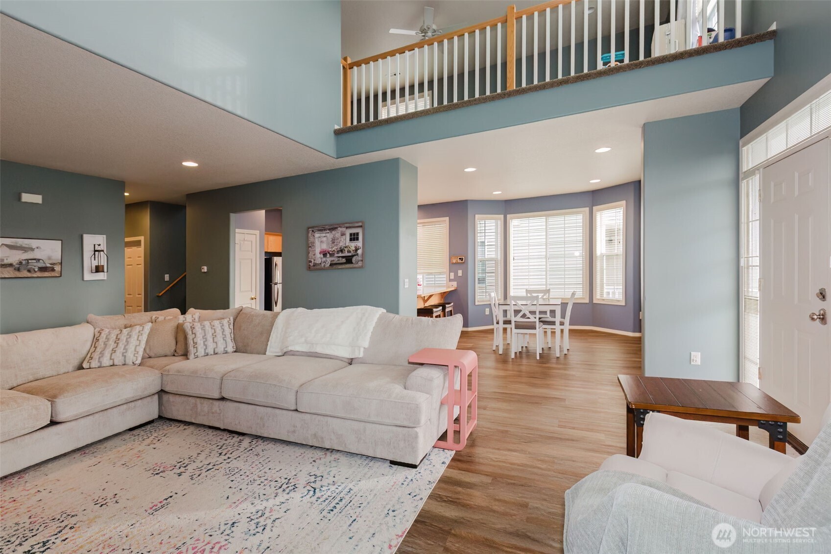 8324 Sweetbrier Loop Southeast Olympia, WA 98513 - Photo 9 of 39 a living room with furniture and wooden floor