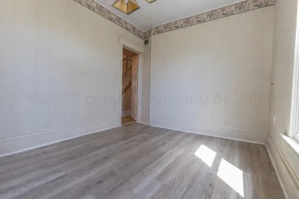 a view of a workspace with furniture and a potted plant