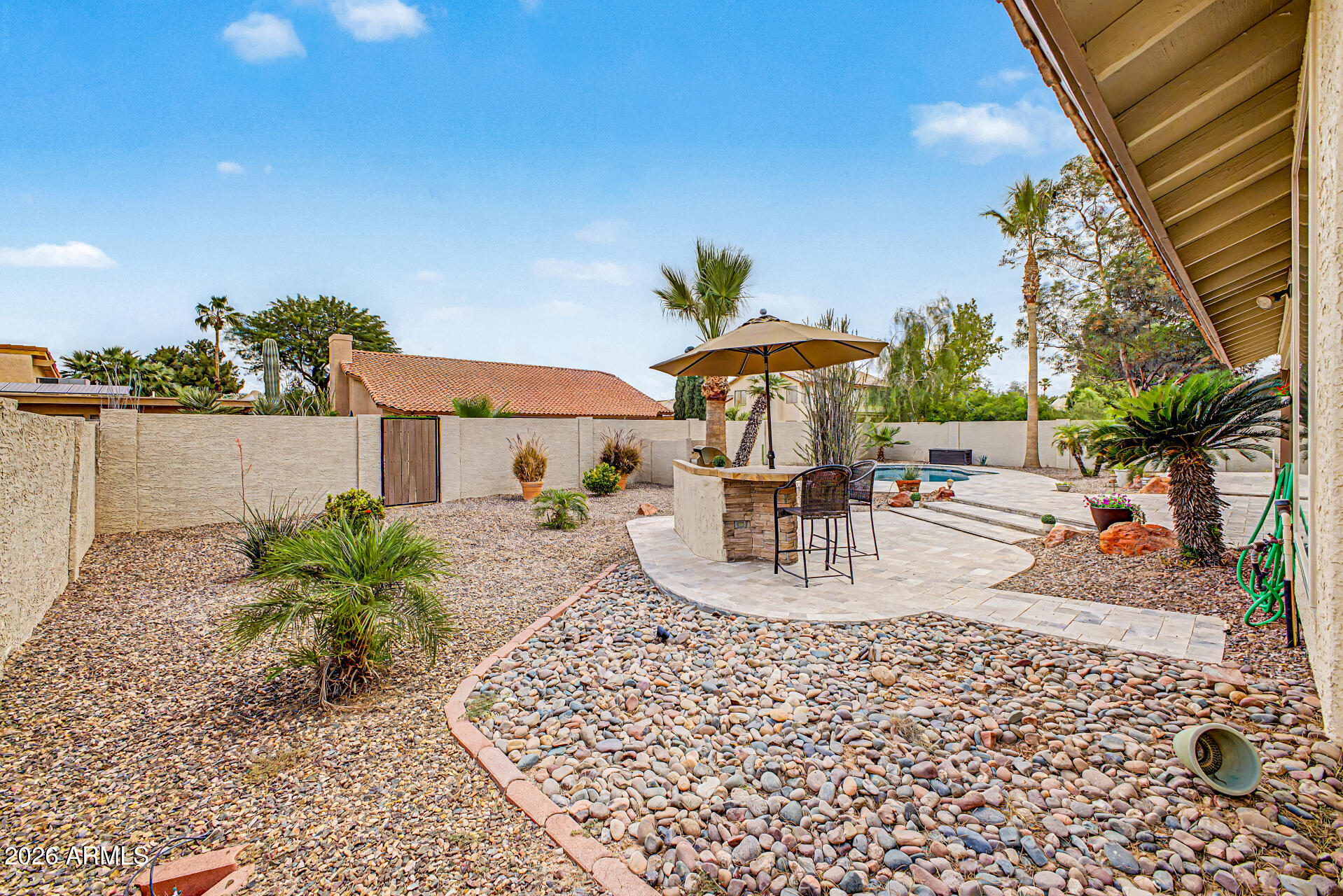 1924 East El Freda Road Tempe, AZ 85284 - Photo 51 of 56 a view of a patio with a table and chairs