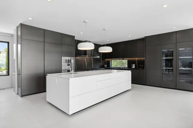 a kitchen with stainless steel appliances a refrigerator and a stove