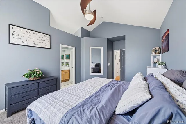 a bedroom with a bed and a dresser in it