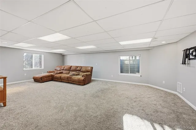 a big room with a bed and a window