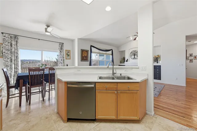 a kitchen with center island table and chairs