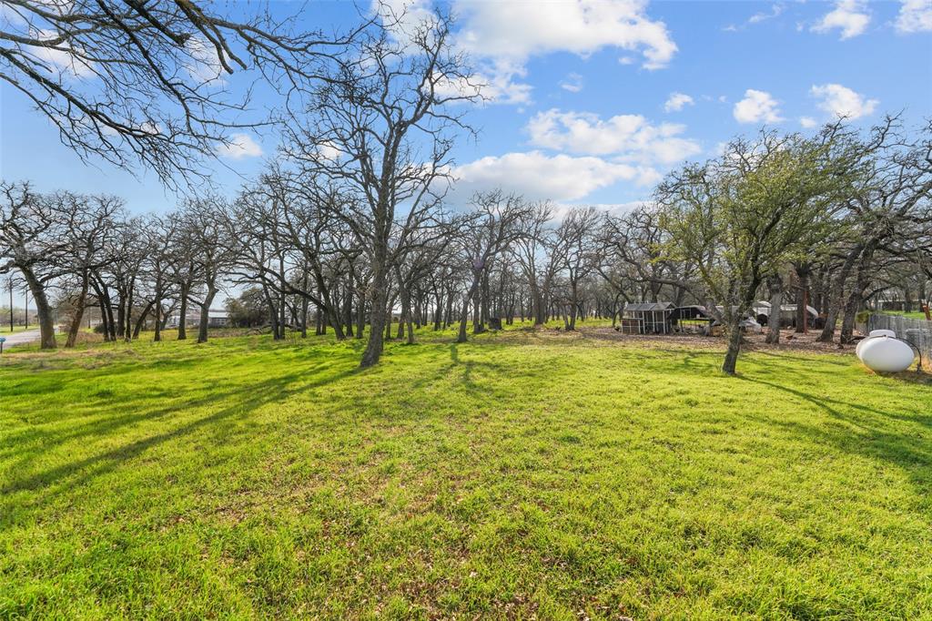 1051 Lynch Bend Road Springtown, TX 76082 - Photo 37 of 39 a view of swimming pool with an outdoor space and seating area