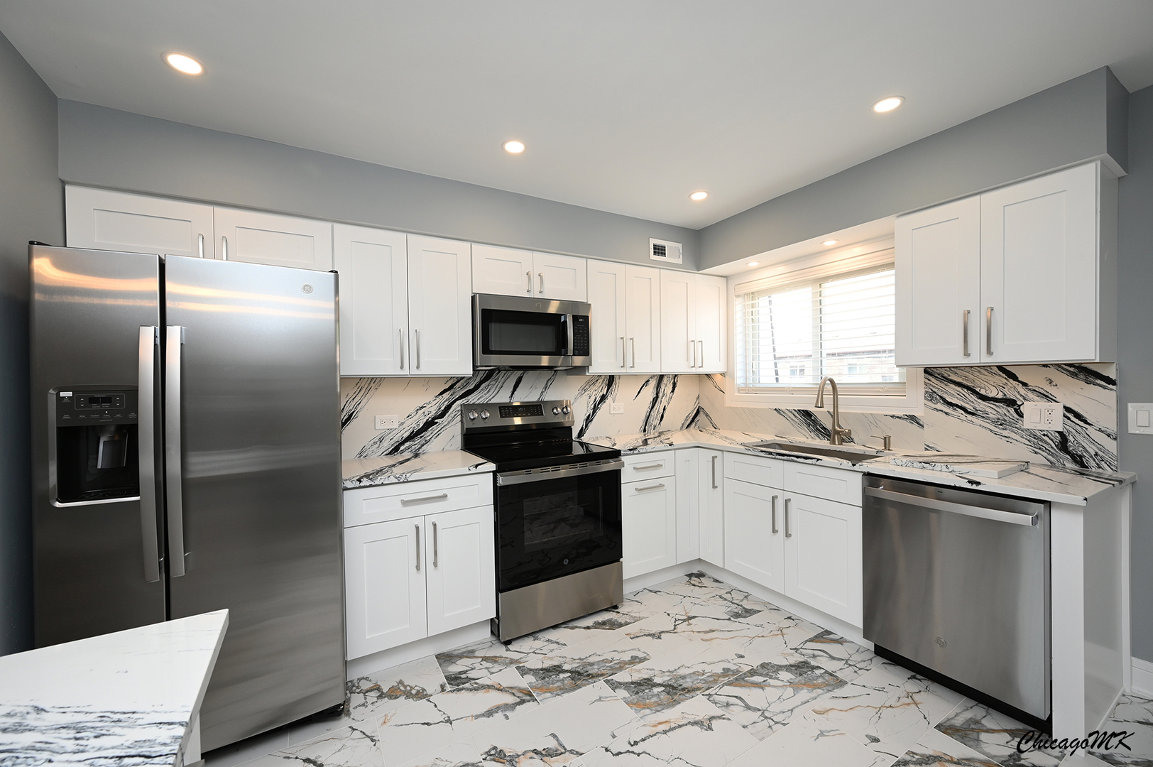 9381 Bay Colony Drive, Unit 3S Des Plaines, IL 60016 - Photo 14 of 43 a kitchen with stainless steel appliances granite countertop a sink a stove a refrigerator and cabinets