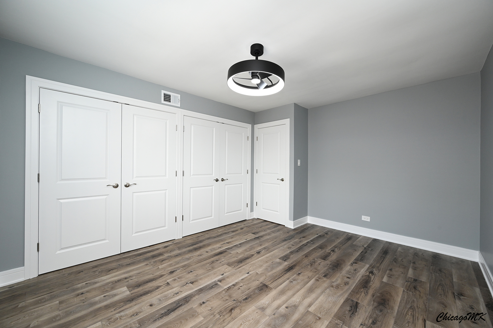 9381 Bay Colony Drive, Unit 3S Des Plaines, IL 60016 - Photo 24 of 43 a view of a room with wooden floor