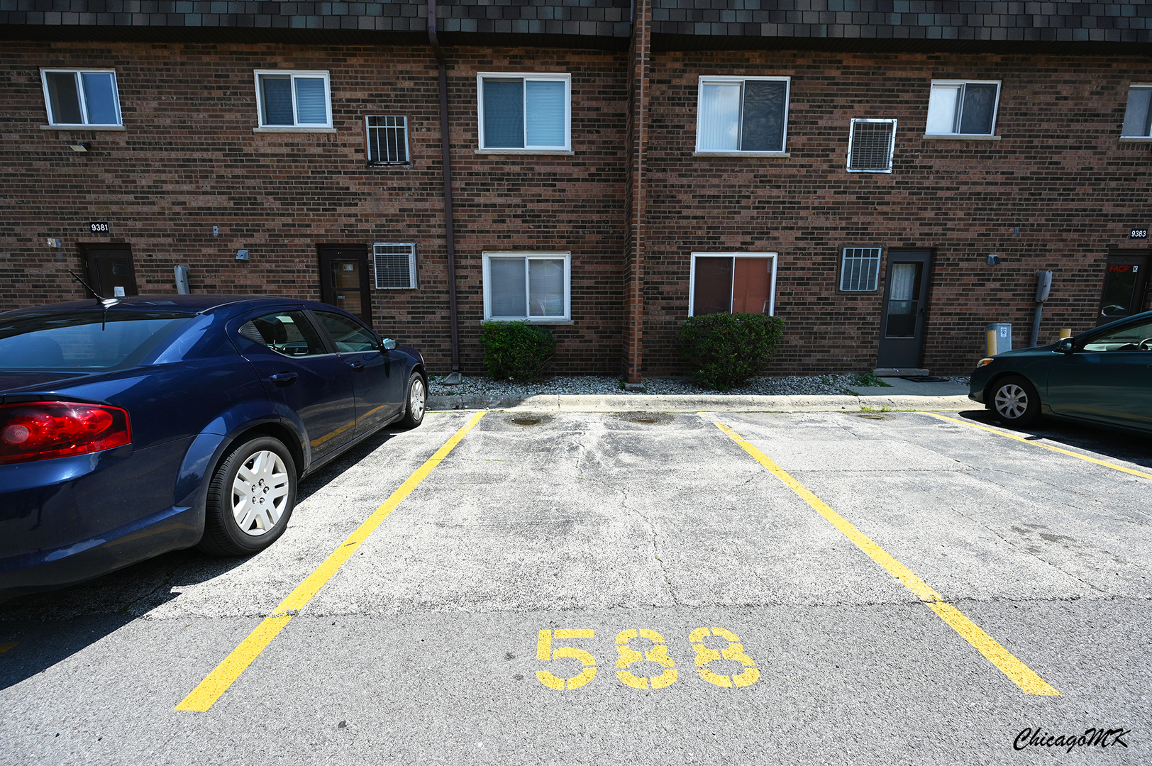 9381 Bay Colony Drive, Unit 3S Des Plaines, IL 60016 - Photo 36 of 43 a view of a car parked in front of a brick building