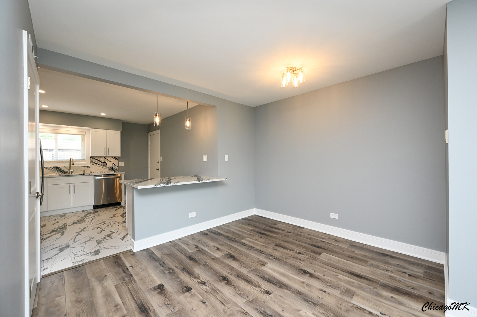 9381 Bay Colony Drive, Unit 3S Des Plaines, IL 60016 - Photo 8 of 43 a view of kitchen with wooden floor