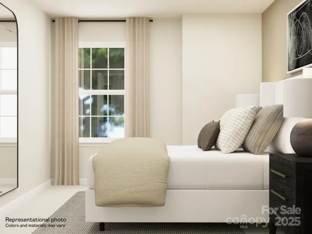 a bedroom with a bed and wall painting