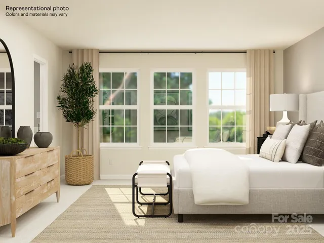 a bedroom with a bed and lamp