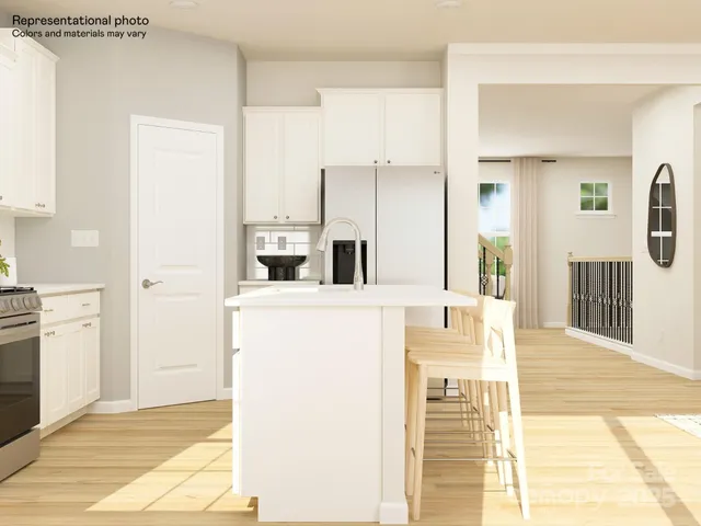 a kitchen with stainless steel appliances cabinets a microwave and a refrigerator