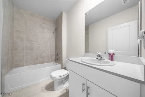 a bathroom with a sink a toilet and a bathtub