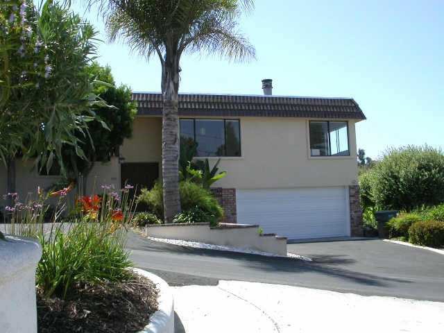 1555 Burgundy Road Encinitas, CA 92024 - Photo 1 of 1 a front view of a house with a yard