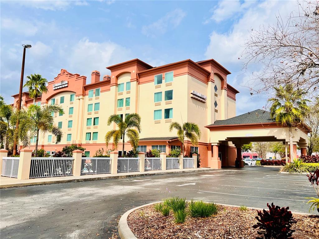 3000 Maingate Lane, Unit 507 Kissimmee, FL 34747 - Photo 1 of 16 a view of a building with a street