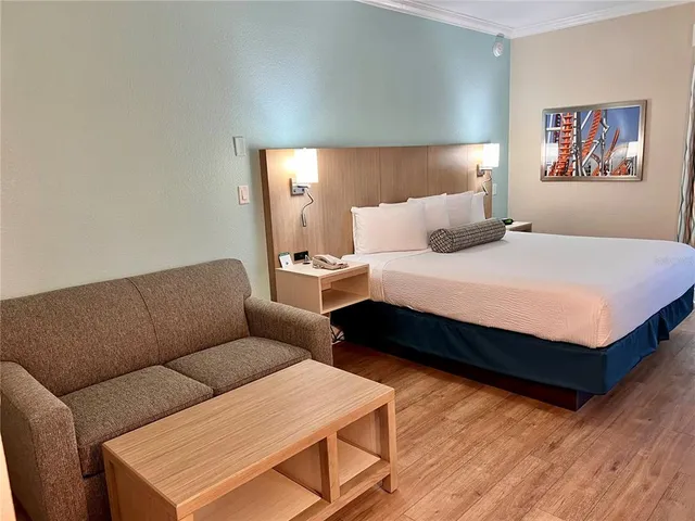 a bed room with a bed window and couch