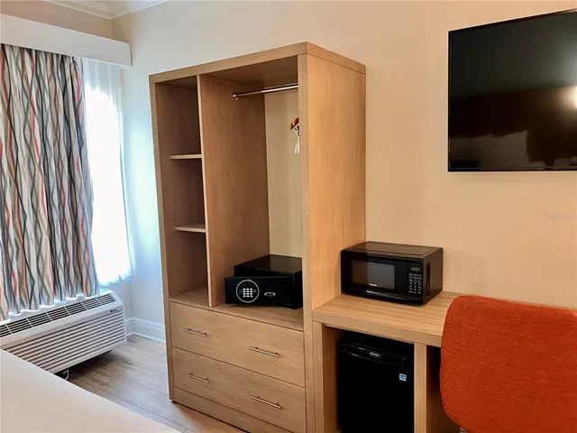 a kitchen with stainless steel appliances a stove and a microwave