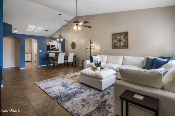 a dining room with furniture and window