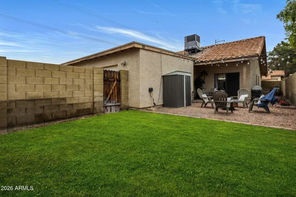 a view of yard from outdoor seating area