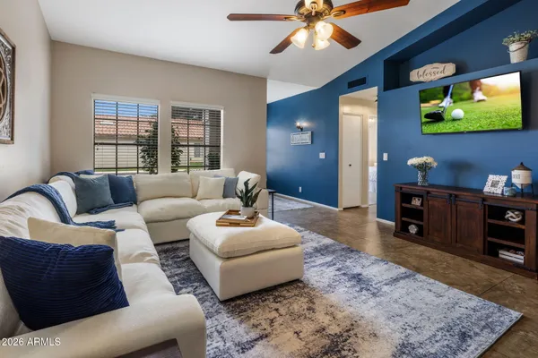 a living room with furniture and a large window