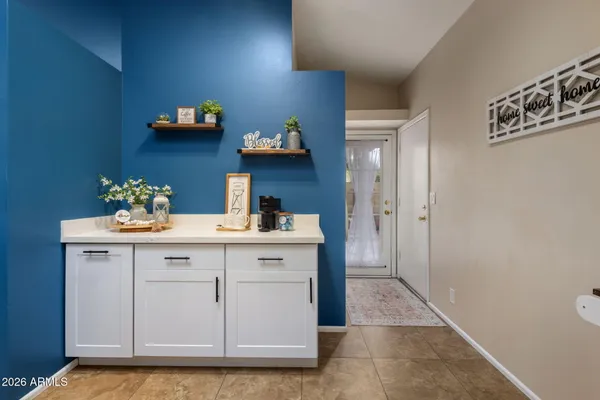 a kitchen with stainless steel appliances granite countertop a stove a sink dishwasher a refrigerator and a oven with wooden floor