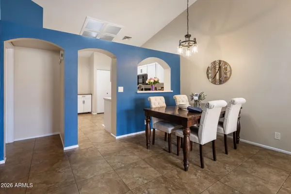 a kitchen with a refrigerator stove and microwave