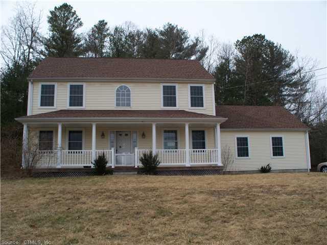 418 Edmond Road Griswold, CT 06351 - Photo 1 of 1 a front view of a house with a garden