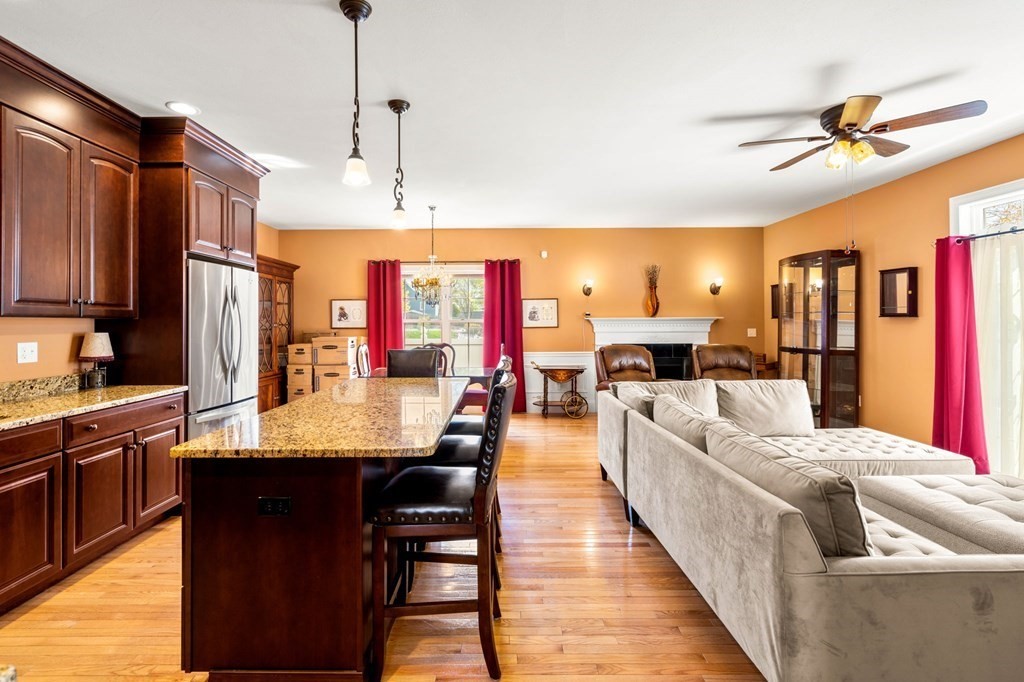 20 Paddock Circle, Unit 20 Salem, NH 03079 - Photo 12 of 29 a large kitchen with stainless steel appliances kitchen island granite countertop a large island in the center