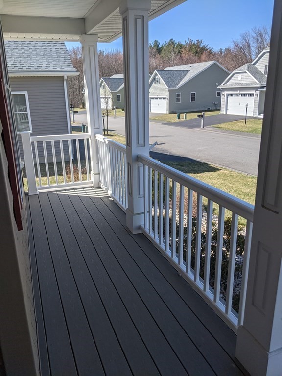 20 Paddock Circle, Unit 20 Salem, NH 03079 - Photo 4 of 29 a view of balcony with wooden floor