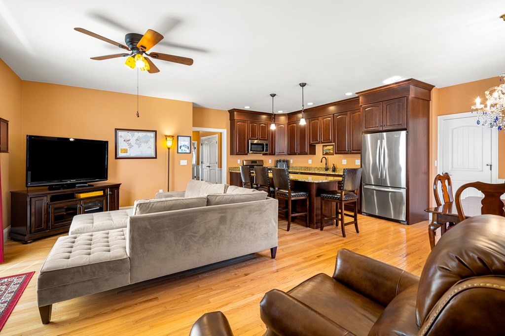 20 Paddock Circle, Unit 20 Salem, NH 03079 - Photo 6 of 29 a living room with fireplace furniture and a flat screen tv