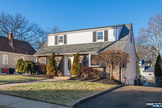 a view of a house with snow in front of it