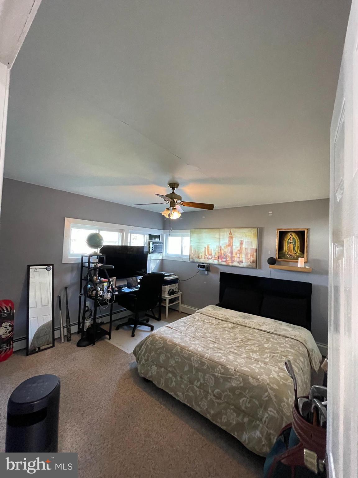 22 Myrtle Lane Levittown, PA 19054 - Photo 13 of 20 a bed room with furniture and a chandelier