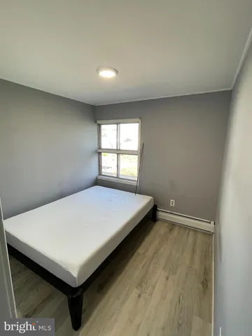 a room with a bed and a window