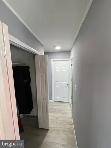 a view of hallway with walk in closet