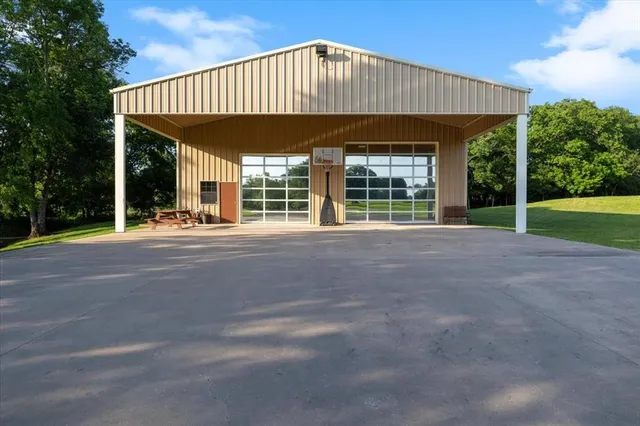 a view of a house with backyard and porch