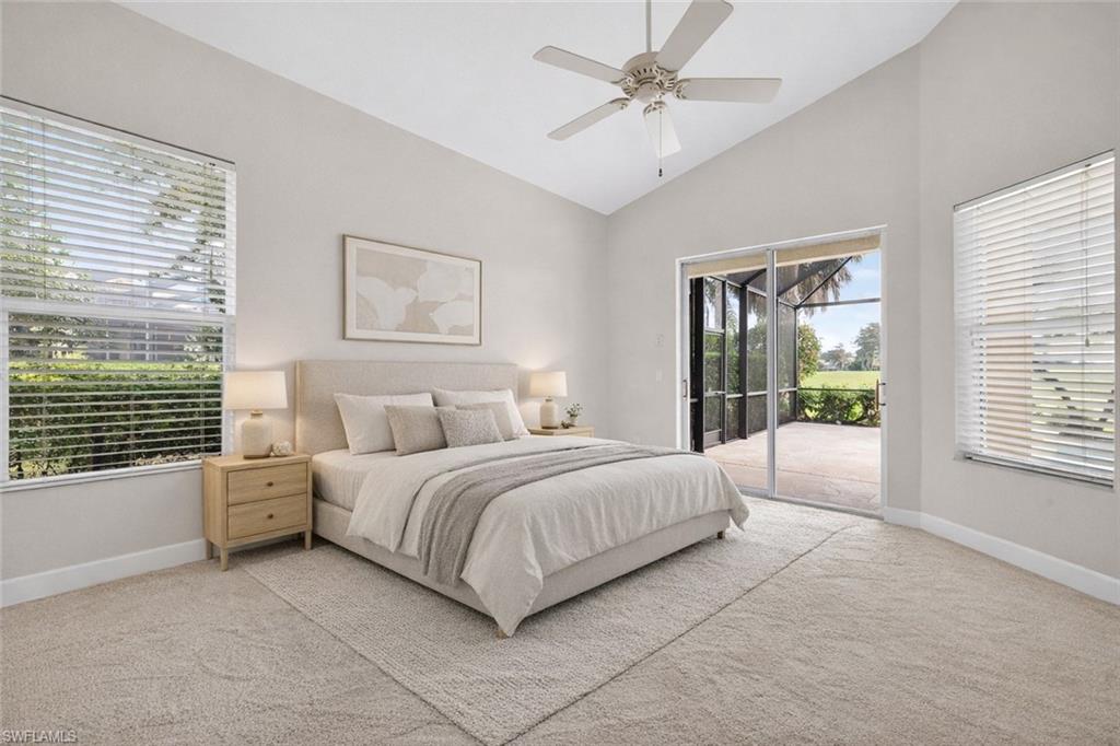 8968 Morgan Court Naples, FL 34113 - Photo 13 of 32 a spacious bedroom with a large bed and a window