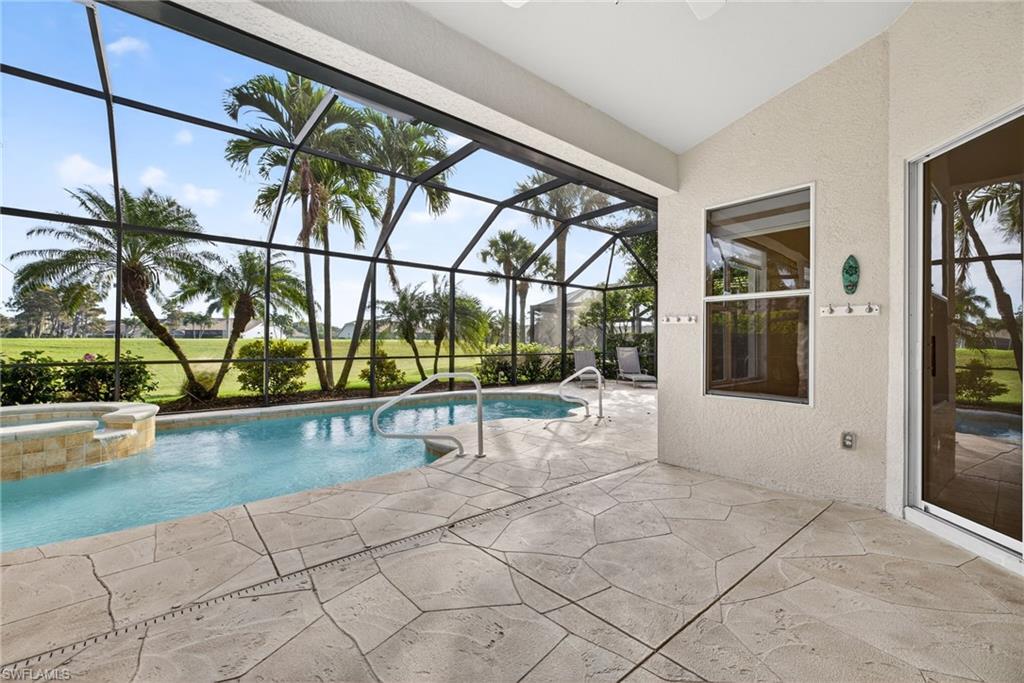 8968 Morgan Court Naples, FL 34113 - Photo 24 of 32 a view of swimming pool with seating space