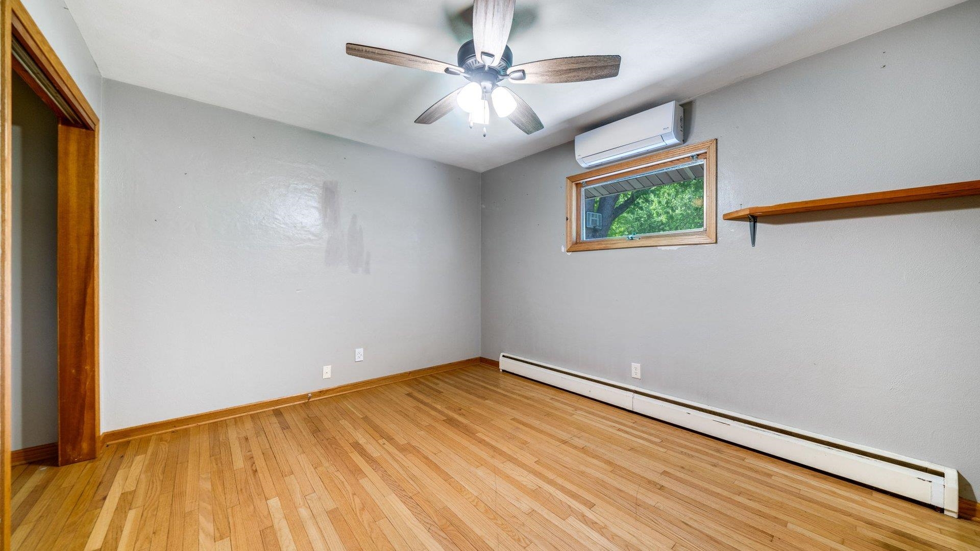 313 West Margaret Fuller Road Oregon, IL 61061 - Photo 23 of 46 wooden floor in an empty room with a window