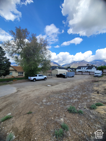 1341 East Crk Road Sandy, UT 84093 - Photo 6 of 24 View of yard featuring a mountain view