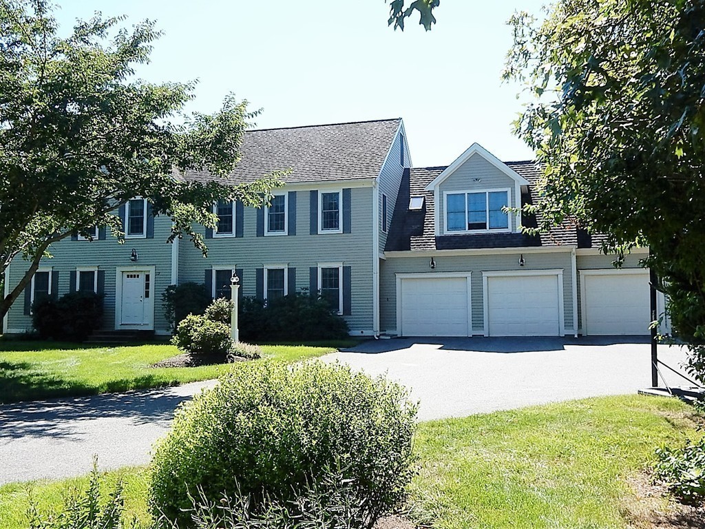 115 Bullivant Farm Road Marion, MA 02738 - Photo 1 of 30 a front view of a house with a yard and garage