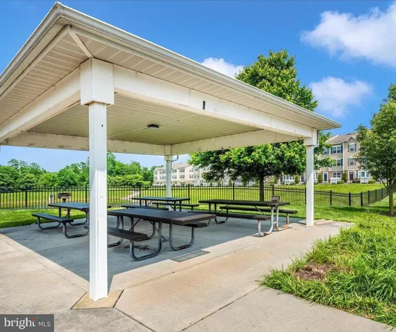 a view of a patio with a table chairs and a table