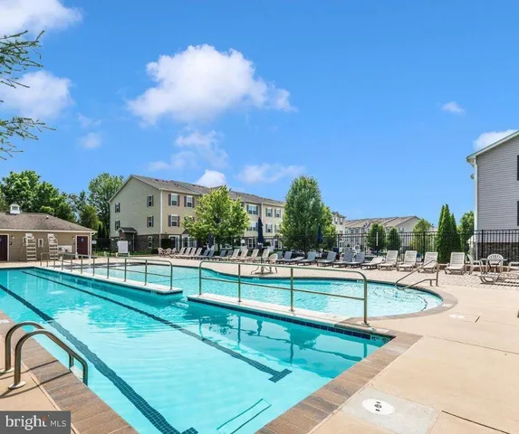 a view of swimming pool with chairs