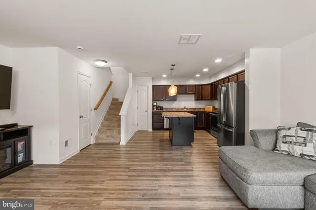 a lobby with furniture and wooden floor