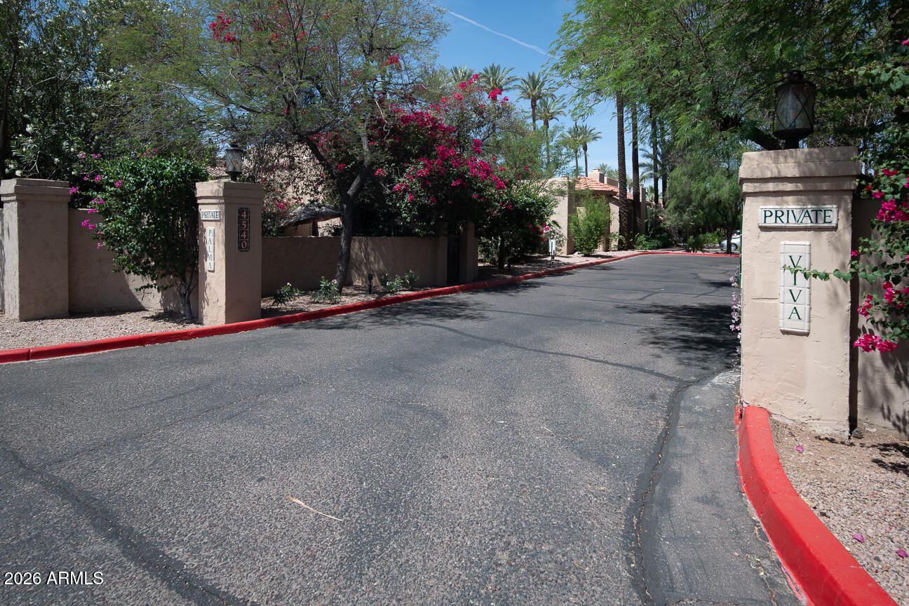 4540 North 44th Street, Unit 50 Phoenix, AZ 85018 - Photo 28 of 31 a front view of a house with a yard and garage