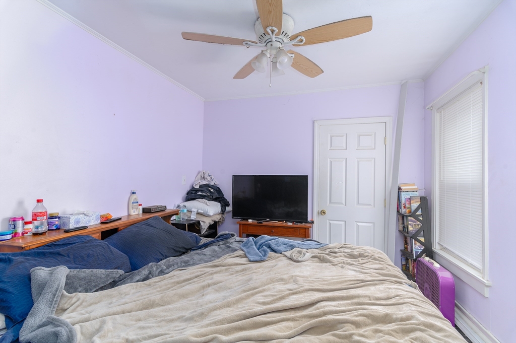 52 Grove Street Spencer, MA 01562 - Photo 14 of 24 a bed room with a bed and a flat screen tv