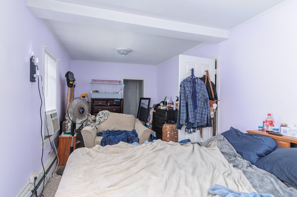 52 Grove Street Spencer, MA 01562 - Photo 15 of 24 a bed room with a bed and a closet