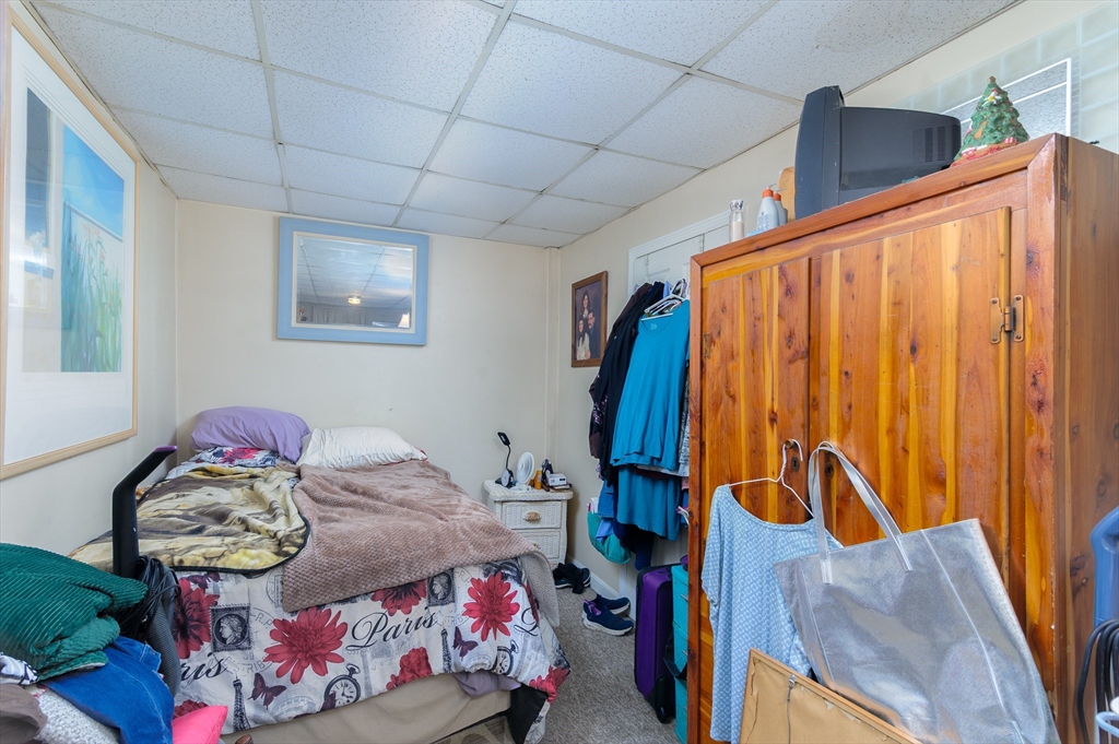 52 Grove Street Spencer, MA 01562 - Photo 6 of 24 a bedroom with a bed and small closet